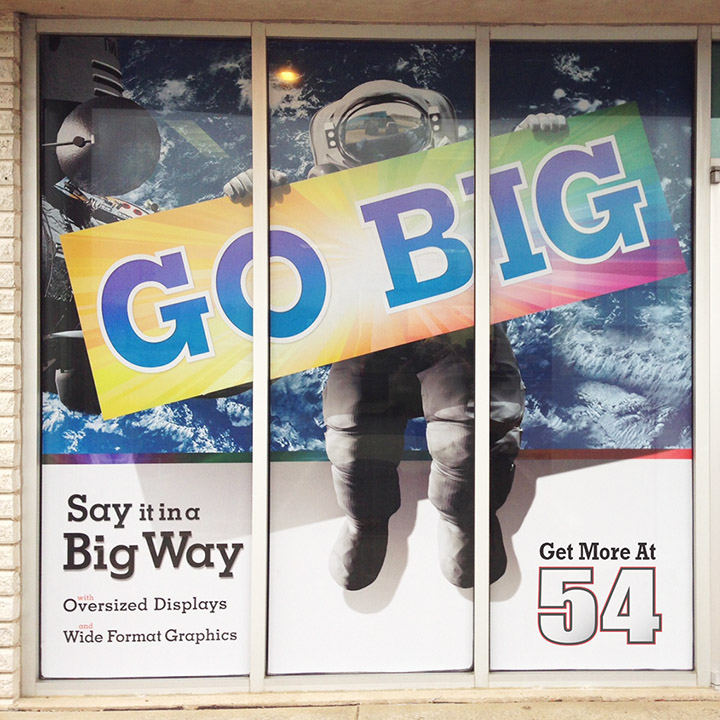 Perforated Adhesive Vinyl on a large, three panel Window Graphic display.
